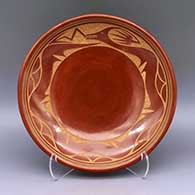Red plate with sgraffito and painted avanyu and geometric design
 by Tony Da of San Ildefonso