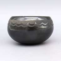 Black-on-black bowl with a geometric design, click or tap to see a larger version