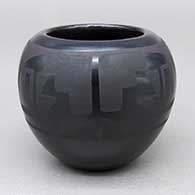 Small black-on-black jar with a feather ring and geometric design
 by Marvin and Frances Martinez of San Ildefonso