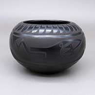 Black-on-black jar with an avanyu, kiva step, ladder, moon, star, raincloud, feather ring, and geometric design
 by Marvin and Frances Martinez of San Ildefonso