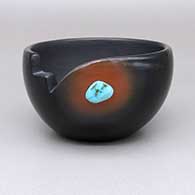 Black bowl with a asymmetrical kiva step geometric and organic cut opening, a sienna spot, and an inlaid turquoise stone detail
 by Dora Tse Pe of San Ildefonso