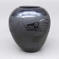 Small black-on-black jar with an avanyu and raincloud geometric design
 by Johnny Cruz of San Ildefonso
