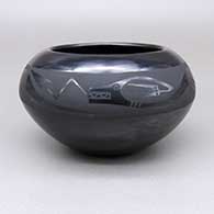 Black-on-black bowl with an avanyu and raincloud geometric design
 by Johnny Cruz of San Ildefonso