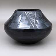 Black-on-black jar with a four-panel geometric design
 by Maria Martinez of San Ildefonso