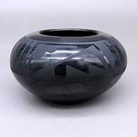 Black-on-black jar with a feather ring and geometric design
 by Maria Martinez of San Ildefonso