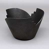 Micaceous black journey bowl with a geometric cut opening
 by Angie Yazzie of Taos
