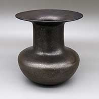 Micaceous black jar with a wide, flared opening
 by Eric Marcus of Taos