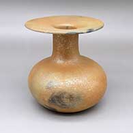 Micaceous gold jar with a wide, flared opening and fire clouds
 by Eric Marcus of Taos