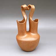Golden micaceous wedding vase with a looped handle
 by Eric Marcus of Taos