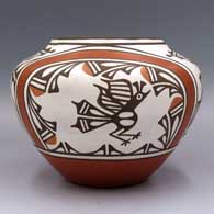 Polychrome jar with a raised rim and a roadrunner, rainbow, butterfly, cloud formation and geometric design, click or tap to see a larger version