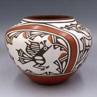 Polychrome jar with a raised rim and a roadrunner, rainbow, butterfly, cloud formation and geometric design
 by Ruby Panana of Zia
