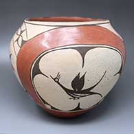 A polychrome jar with a four-panel roadrunner, rainbow and geometric design
 by Helen Gachupin of Zia