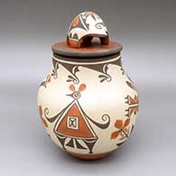 Polychrome lidded jar with a roadrunner, bird, flower, and geometric design and a matching lid with a bear applique
 by Marcellus Medina of Zia