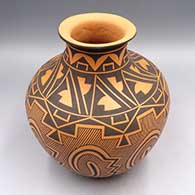 Black-on-salmon jar with flared lip and Tularosa spiral, rain, crosshatching, and geometric design
 by Anderson Jamie Peynetsa of Zuni