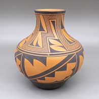 Red and black jar with a four panel geometric design
 by Anderson Jamie Peynetsa of Zuni