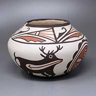 A polychrome jar decorated with a four-panel deer-with-heart-line, rosette and geometric design
 by Unknown of Zuni