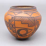 Small black-on-red jar with a two-panel traditional Zuni design featuring fine line, kiva step, and geometric elements
 by Carlos Laate of Zuni