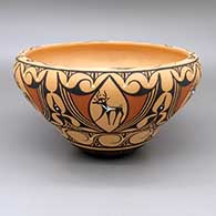 Polychrome bowl with a deer-with-heart-line, tadpole, and geometric design on outside and inside
 by Priscilla Peynetsa of Zuni