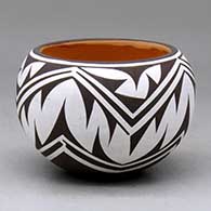 Click for a larger view A small polychrome bowl decorated around the body with a geometric design
by Anderson Jamie Peynetsa of Zuni