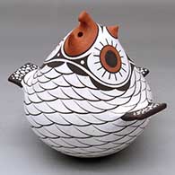 Click for a larger view A polychrome owl effigy pot decorated with a bird element and geometric design
by Anderson Jamie Peynetsa of Zuni