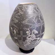 Sgraffito Night of the Dead motif on a black and white jar Black and white jar etched in the sgraffito technique with a Night of the Dead motif