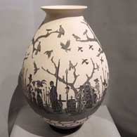 Black and white jar with sgraffito Day of the Dead motif Sgraffito Day of the Dead motif on a black and white jar