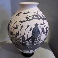 Black and white jar with sgraffito Day of the Dead design Sgraffito Day of the Dead design on a black and white jar