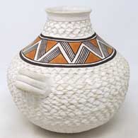 White jar with handles and a corrugated surface