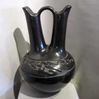 Black wedding vase carved with avanyu design, by Margaret Tafoya of Santa Clara Pueblo Avanyu design carved into a black wedding vase