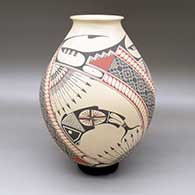 A polychrome jar with a rolled lip and decorated with a fish, arrow, tiny square and geometric design