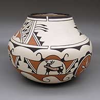 A polychrome jar decorated with a traditional Zuni design featuring deer-with-heart-line and geometric elements
