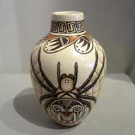 Spider design on a white polychrome pot