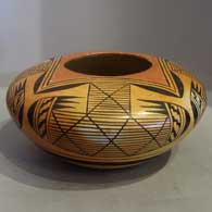 Awatovi star and batwing design on a yellow ware jar