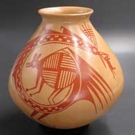 A polychrome jar decorated with a Mimbres animal, bird and geometric design