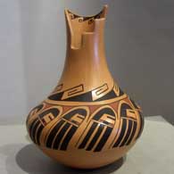 Geometric and long-haired katsina design on a polychrome jar