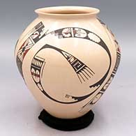 A polychrome jar with a flared rim and decorated with a 3-panel geometric design
