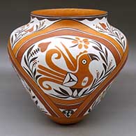 A large, high-shouldered polychrome jar decorated with a four-panel parrot, rainbow, plant, flower and geometric design