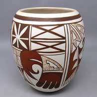 A polychrome jar decorated with a four-panel bird element and geometric design