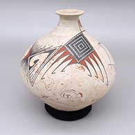 A polychrome marbleized clay jar with a short recurved neck and decoerated with a geometric design