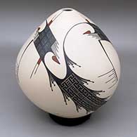 A polychrome jar decorated with a flowing geometric design