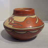 A polychrome jar with an avanyu and rain cloud design