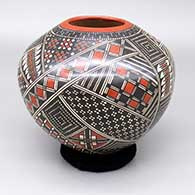 A polychrome jar with a tiny squares and geometric design