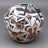 A polychrome seed pot decorated with multiple Mimbres animal, insect and geometric designs