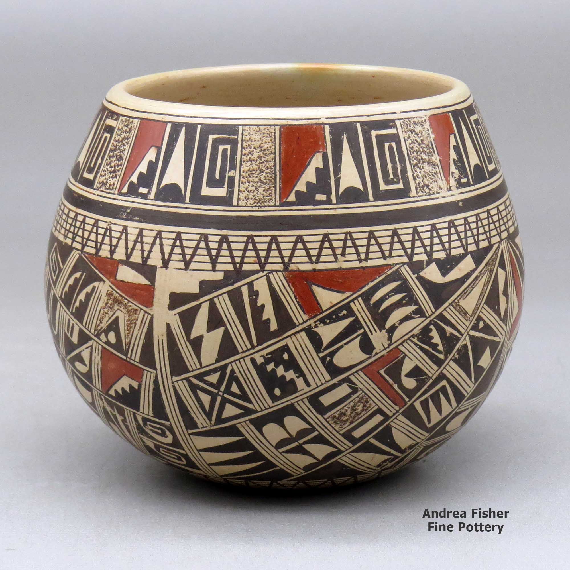 Click or tap to see a larger view A polychrome bowl polished on the inside and decorated around the outside with a four panel small sherd and geometric design made by Rondina Huma of Hopi
