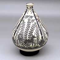 Click for a larger view A polychrome low shouldered, tiny neck jar decorated with a four panel wildlife and nature design, with fish around the bottom
by Hector Gallegos Jr of Mata Ortiz and Casas Grandes