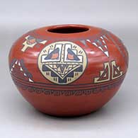 A polychrome jar decorated with a four panel medallion and geometric design around and above the shoulder
 by Minnie Vigil of Santa Clara