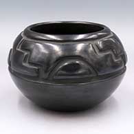 Black jar carved with a 4-panel geometric design
 by Margaret Tafoya of Santa Clara