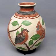 Polychrome jar with sgraffito and painted bird, branch and geometric design
 by Jesus Olivas of Mata Ortiz and Casas Grandes