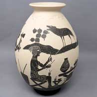 Black and white jar with sgraffito Aztec family yard design
 by Humberto Guillen Rodriguez of Mata Ortiz and Casas Grandes