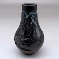 A polychrome vase carved with an avanyu design and decorated with a sgraffito and painted masked Hopi dancer and geometric design
 by Ergil Vallo of Acoma